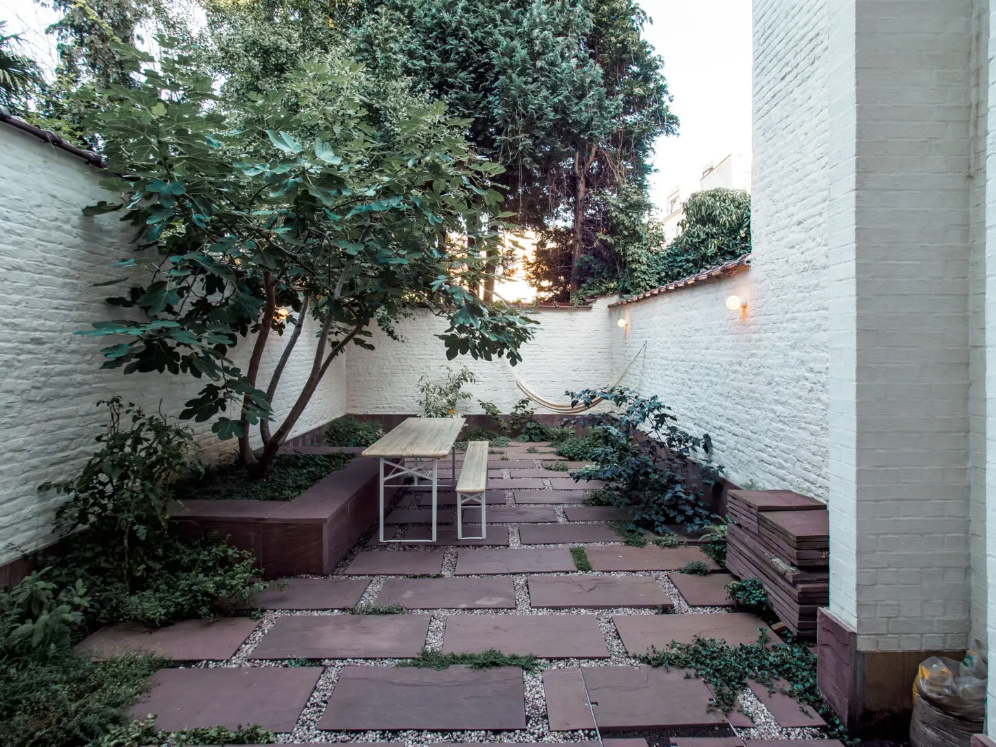 DELANNOY Renovation of a single-family house, Photo of back garden with re-used natural stone paving
