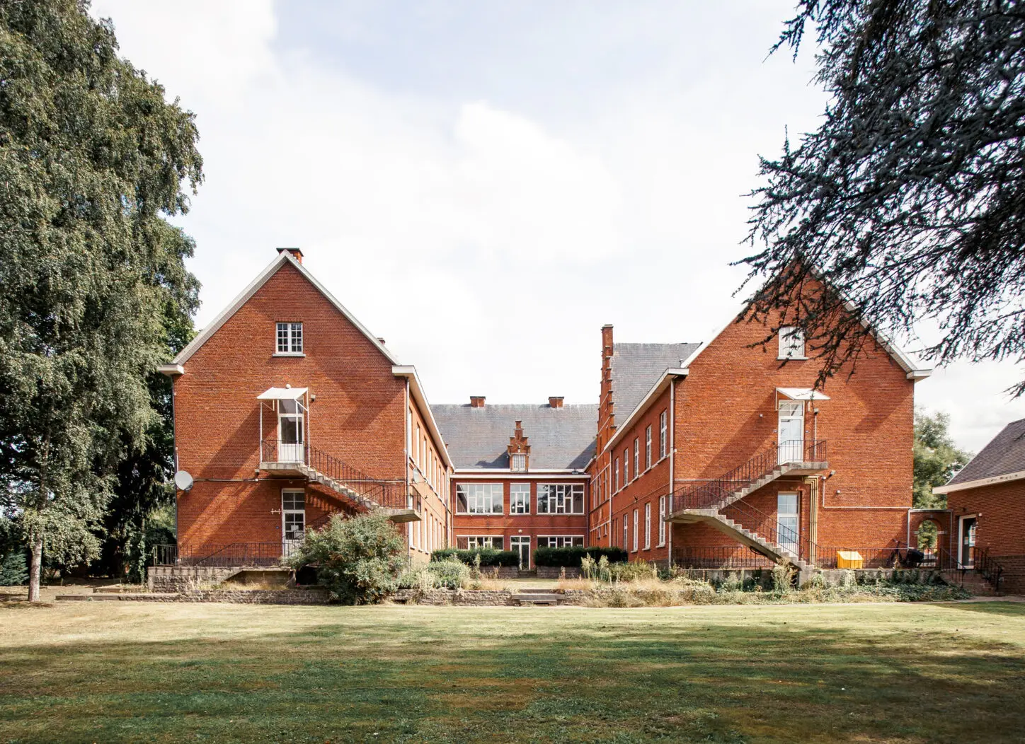 ZEMST Residential care center for the elderly, back view historic building